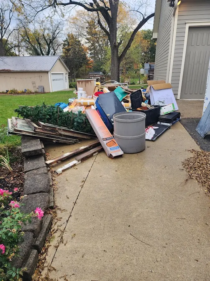 Dumpster being loaded with debris for Roofing Dumpster Rental in Riverside